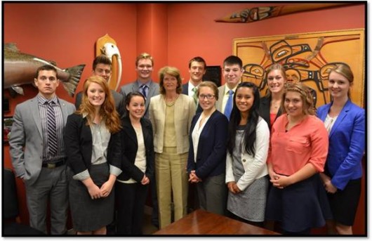 From left are Corey Hester, Kelsey Cunningham, Thaddues Isaacs, Madeleine Moore, Connor Hula, Senator Murkowski, John Gutsch, Maggie Graham, Mitchell Forbes, Rachell Gulanes, Emelia Van Whye, Kenzie Bjerken, and Ayla O’Scannell.