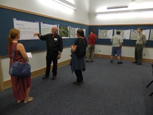 John Barnett of the Alaska Department of Transportation answers questions during the Gravina Access Project open house.