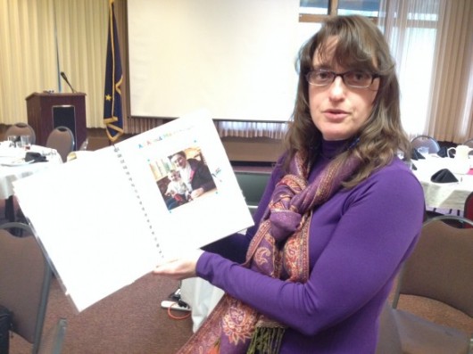 Jessica Mills Clark shows materials that are part of the Best Beginnnings program for families with young children.