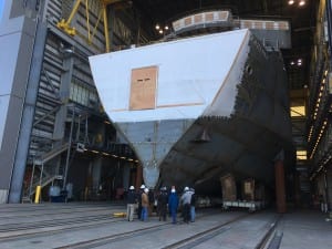 Vigor Alaska crew members confer before moving the forward half of the Alaska Class Ferry Tazlina out of the assembly hall at the Ketchikan shipyard. (Photo by Leila Kheiry)