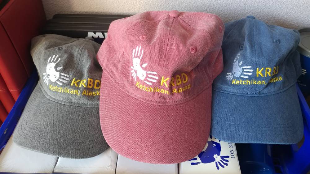 KRBD hats in grey, red, and blue.